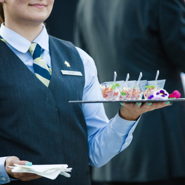 Waiter carrying food.